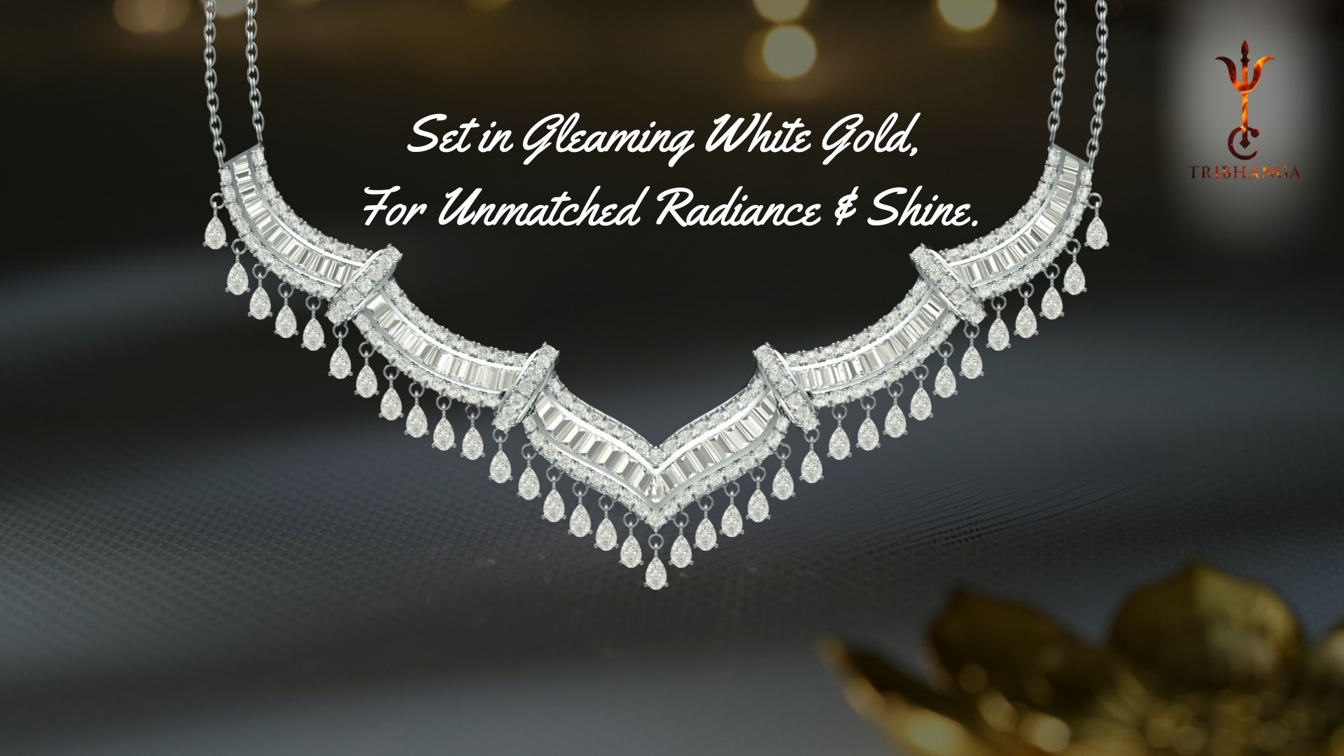 Tribhanga diamond and white gold jewellery necklace featuring baguette channel setting and pear-cut drops.