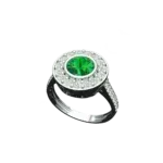 Angled view of the Tribhanga emerald bezel ring showing the sleek setting.