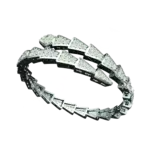 Geometric white gold bracelet with spiral diamond design.