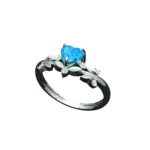 Angled view of the Tribhanga blue heart ring showing the floral band details.