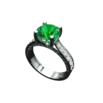 Angled view of the Tribhanga round emerald ring showing the side scroll details.