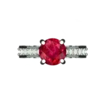 Top view of the Tribhanga round ruby ring displaying the center stone.