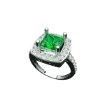 Angled view of the Tribhanga square emerald ring showing the princess cut stone and setting.